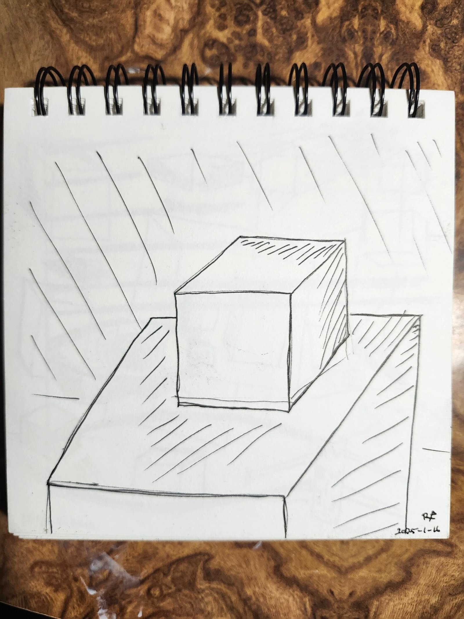 Sketchbook drawing of stacked cubes with diagonal hatching to study light and shadow.