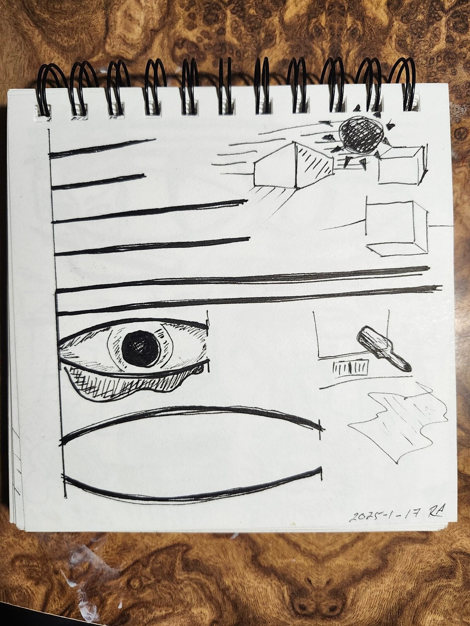 Daily sketchbook warmup page with curves, ellipses, and a sketch of an eye